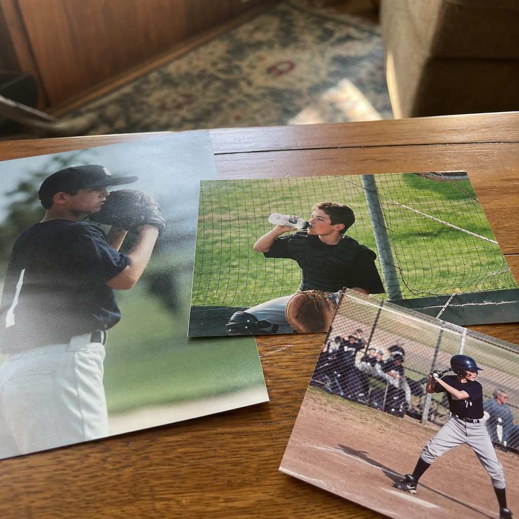 A few printed sports photos on a table